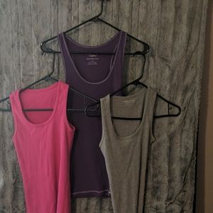 3 ribbed tank tops sold together. Only flaw is on the purple AMERICAN EAGLE